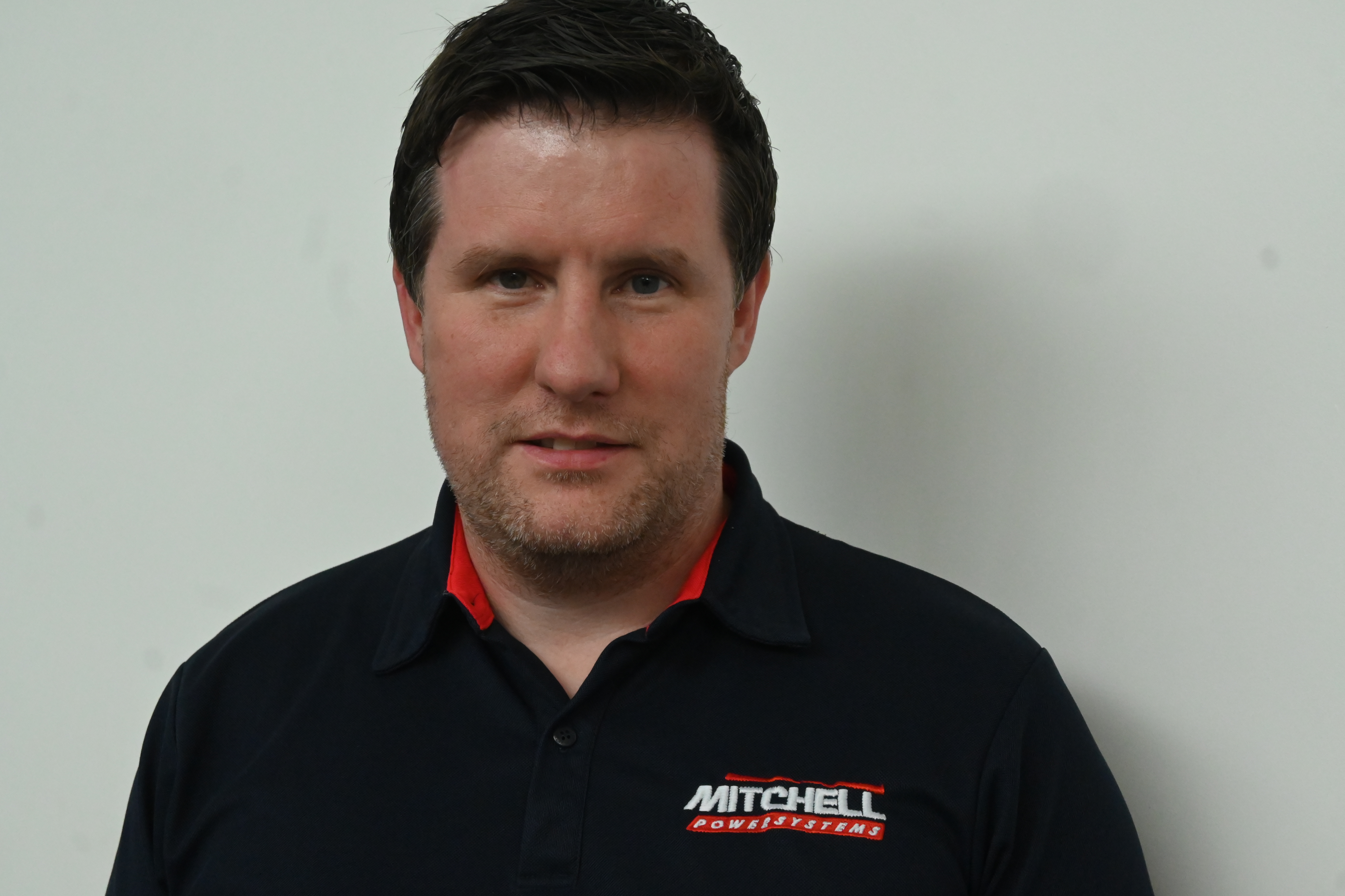 man in mitchell powersystems uniform