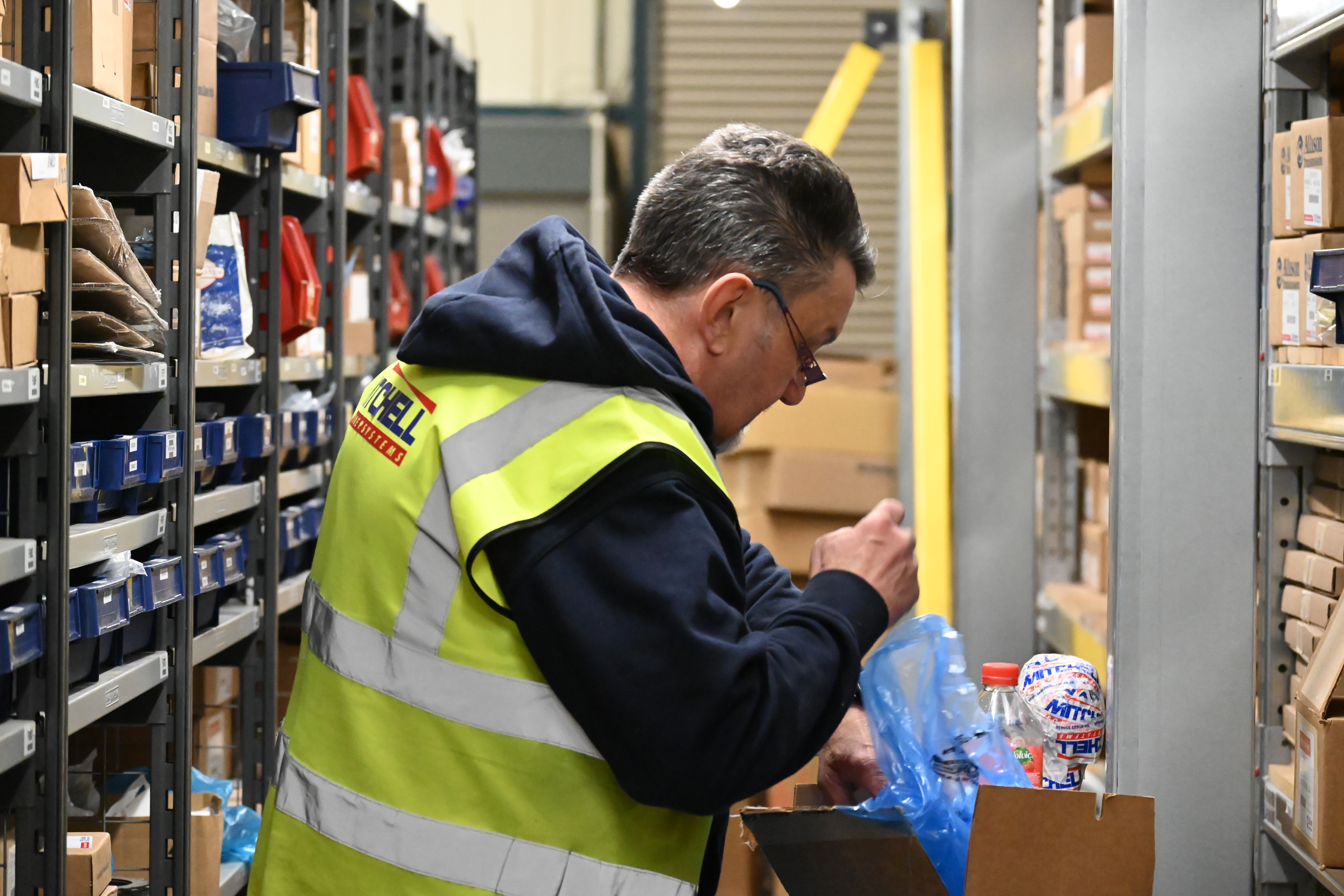warehouse worker packaging goods